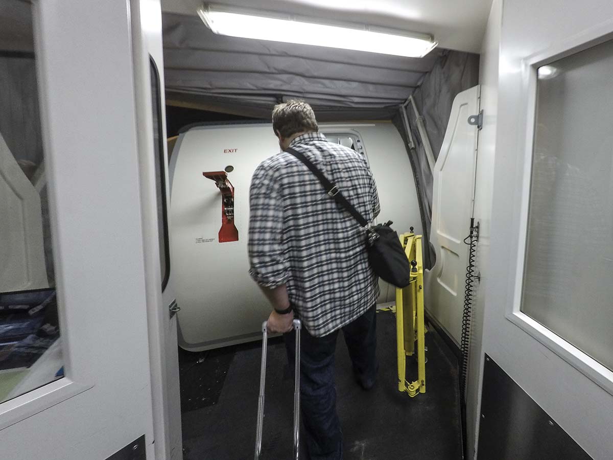 Boarding a Delta Connection Embraer 175 through the forward boarding door