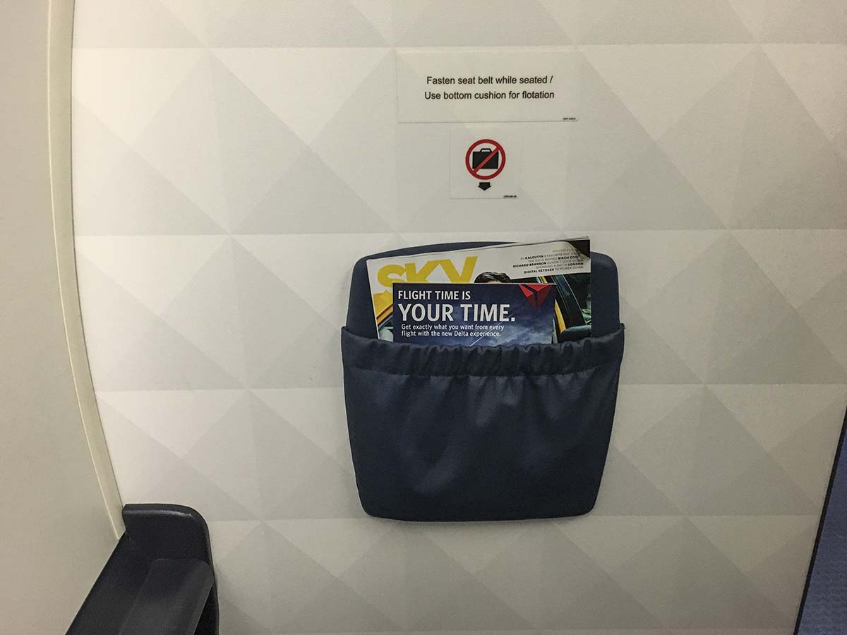 Delta Connection Embraer 175 first class bulkhead row storage pocket