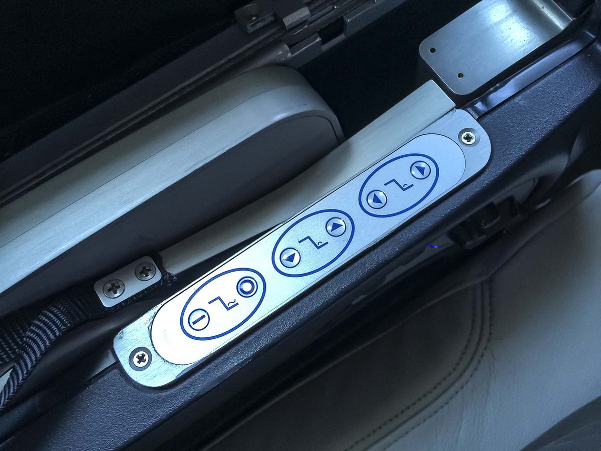 Virgin America A319 first class seat massage function control panel located beneath armrest