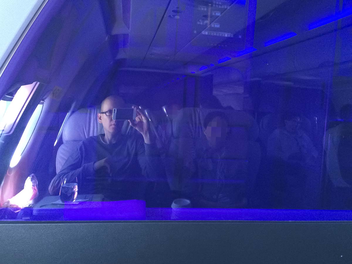 Purple transparent bulkhead wall Virgin America A319 first class