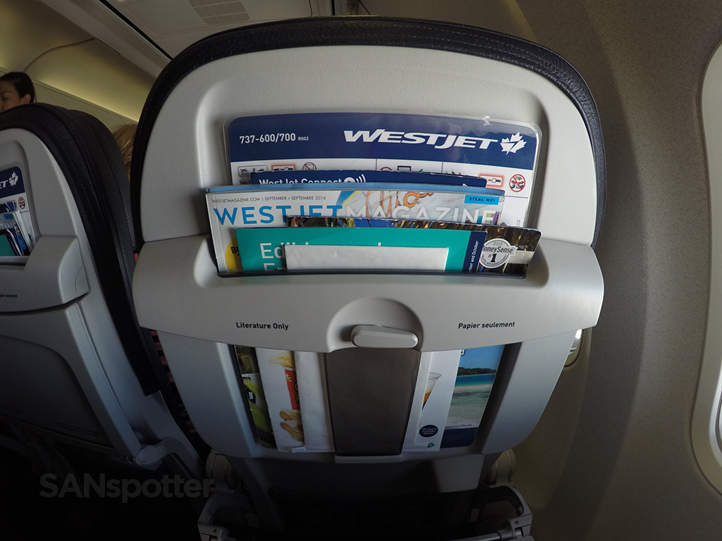 WestJet 737-700 economy seat back pocket opening with tray table down 2016