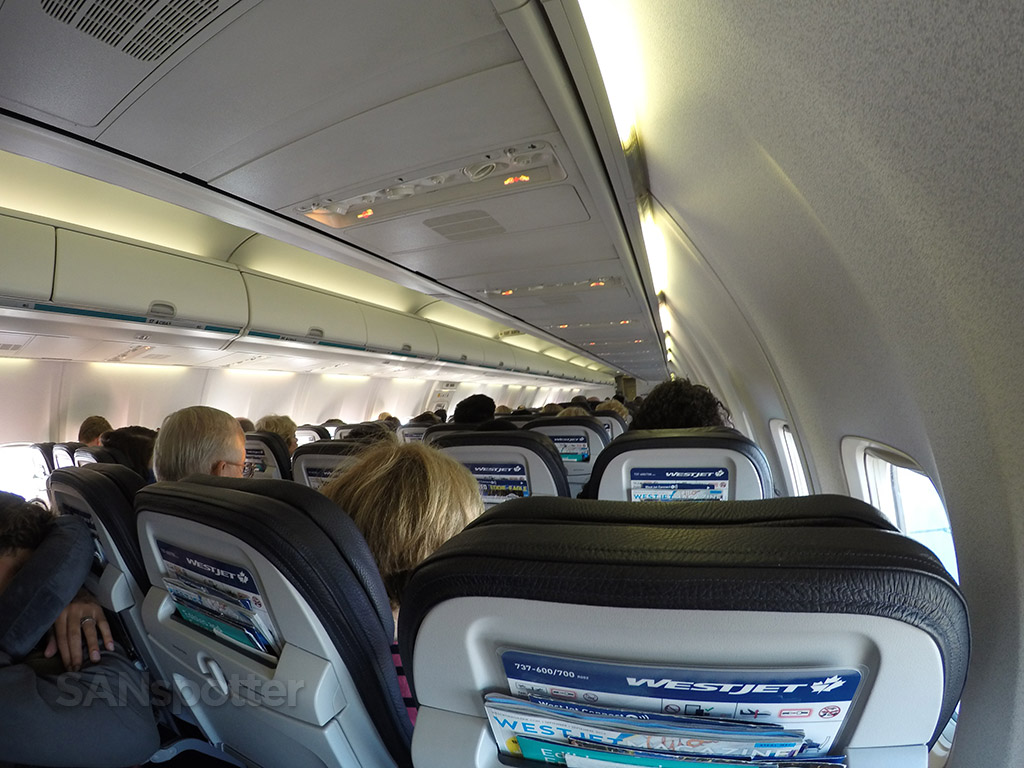 WestJet 737-700 economy cabin looking forward from the back in 2016