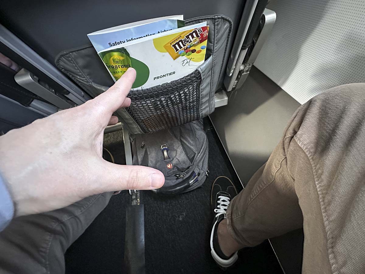 Reaching for the in-flight menu on a Frontier Airlines A321 
